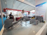 Visitors are viewing a model of the ''intelligent dry coal separator'' at the 2024 Beijing International Coal Mining Technology and Equipmen...