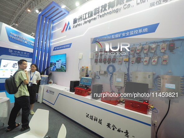 Visitors are visiting the ''Coal Mine Safety Monitoring System'' at the 2024 Beijing International Coal Mining Technology and Equipment Exhi...