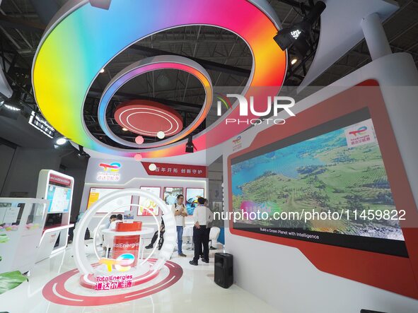 Visitors are visiting the booth of ''Total Energy'' at the 2024 Beijing International Coal Mining Technology and Equipment Exhibition in Bei...