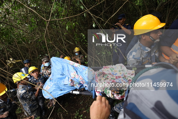 A helicopter carrying four Chinese nationals is crashing in Nuwakot District, Nepal, on August 7, 2024. A total of 5 people, including the p...