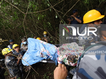 A helicopter carrying four Chinese nationals is crashing in Nuwakot District, Nepal, on August 7, 2024. A total of 5 people, including the p...