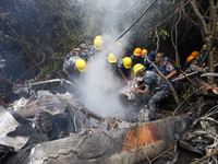 Members of the Nepal Armed Police Force and Nepal Army are searching for the bodies of victims of the Air Dynasty Helicopter crash in Nuwako...