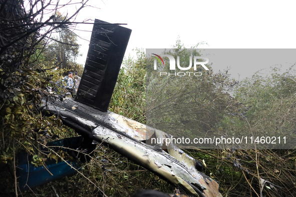 The wreckage of the Air Dynasty Helicopter is lying on the slopes of a hillside after the crash in Nuwakot District, Nepal, on August 7, 202...