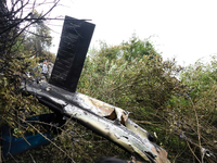 The wreckage of the Air Dynasty Helicopter is lying on the slopes of a hillside after the crash in Nuwakot District, Nepal, on August 7, 202...