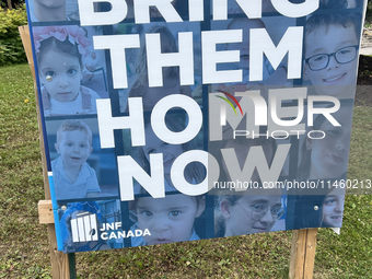 A sign for the Jewish National Fund (JNF) is outside a synagogue in Toronto, Ontario, Canada, on July 30, 2024. These signs are being target...