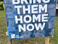 A sign for the Jewish National Fund (JNF) is outside a synagogue in Toronto, Ontario, Canada, on July 30, 2024. These signs are being target...