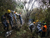 Members of the Nepal Armed Police Force and Nepal Police are searching the wreckage of the Air Dynasty Helicopter that crashed in Nuwakot Di...