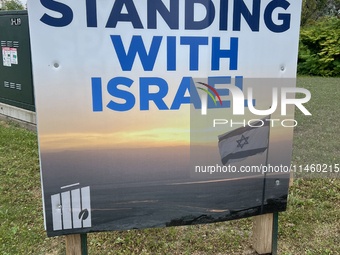 A sign for the Jewish National Fund (JNF) is outside a synagogue in Toronto, Ontario, Canada, on July 30, 2024. These signs are being target...