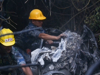 Members of the Nepal Armed Police Force and Nepal Police are searching the wreckage of the Air Dynasty Helicopter that crashed in Nuwakot Di...