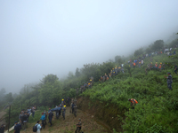 Nepali security forces are carrying the bodies of victims to the hearse from the site of the crashed Air Dynasty Helicopter in Nuwakot Distr...