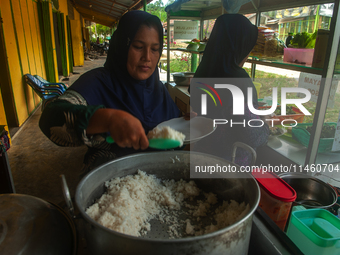 The residents of the Matfa village (Majelis Taqlim Fardhu Ain) in Langkat, North Sumatra, Indonesia, on August 06, 2024, are actively implem...