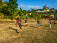 On August 06, 2024, the children of the Matfa village (Majelis Taqlim Fardhu Ain) area are playing football in Langkat, North Sumatra, Indon...