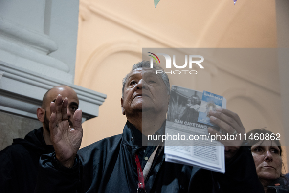 A crowd is leaving the Buenos Aires neighborhood of Liniers as part of the celebration of the day of San Cayetano, the patron saint of bread...