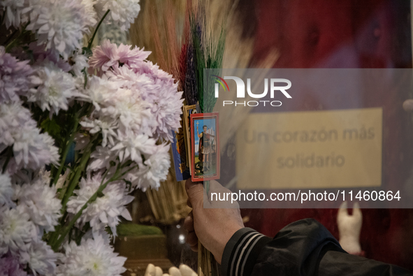 A crowd is leaving the Buenos Aires neighborhood of Liniers as part of the celebration of the day of San Cayetano, the patron saint of bread...