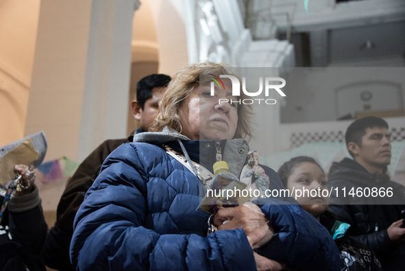 A crowd is leaving the Buenos Aires neighborhood of Liniers as part of the celebration of the day of San Cayetano, the patron saint of bread...