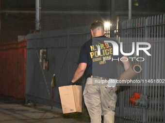 Crime scene investigators from the New York City police department are on scene investigating human remains found and are bringing out evide...