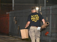 Crime scene investigators from the New York City police department are on scene investigating human remains found and are bringing out evide...