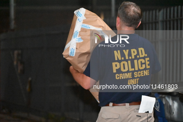 Crime scene investigators from the New York City police department are on scene investigating human remains found and are bringing out evide...