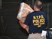 Crime scene investigators from the New York City police department are on scene investigating human remains found and are bringing out evide...