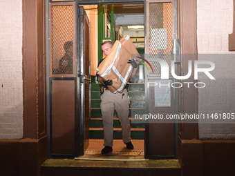 Crime scene investigators from the New York City police department are on scene investigating human remains found and are bringing out evide...