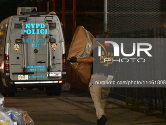 Crime scene investigators from the New York City police department are on scene investigating human remains found and are bringing out evide...