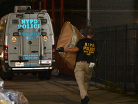 Crime scene investigators from the New York City police department are on scene investigating human remains found and are bringing out evide...