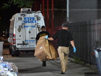 Crime scene investigators from the New York City police department are on scene investigating human remains found and are bringing out evide...