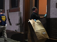 Crime scene investigators from the New York City police department are on scene investigating human remains found and are bringing out evide...