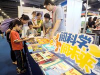 Children are reading science and technology books at the first Beijing International Science Festival 2024 in Beijing, China, on August 8, 2...