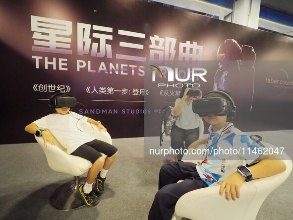 Children are experiencing ''VR Star Trilogy'' at the first Beijing International Science Festival in Beijing, China, on August 8, 2024. 