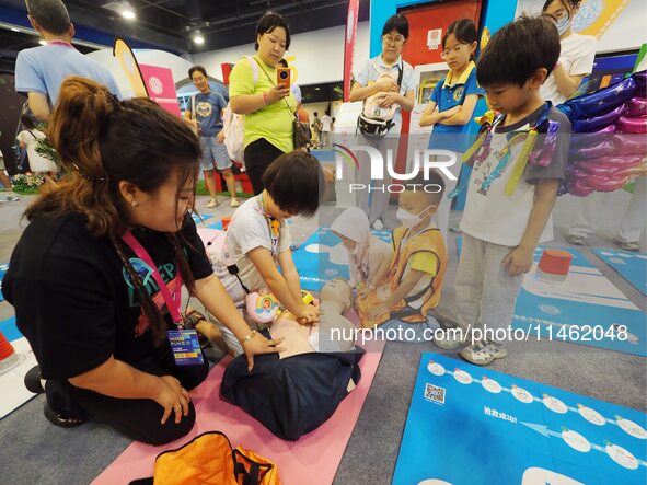 A child is experiencing cardiopulmonary resuscitation (CPR) at the first Beijing International Science Festival in Beijing, China, on August...