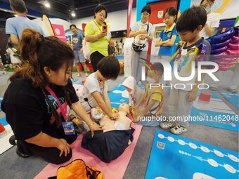 A child is experiencing cardiopulmonary resuscitation (CPR) at the first Beijing International Science Festival in Beijing, China, on August...