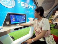 A child is being tested by the ''Smart Health E-station'' at the first Beijing International Science Festival in Beijing, China, on August 8...