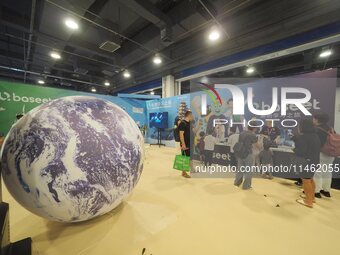 Visitors are visiting a scientific experiment at the first Beijing International Science Festival 2024 in Beijing, China, on August 8, 2024....