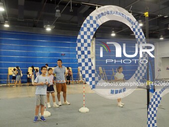 A child is experiencing a ''drone race'' at the first Beijing International Science Festival 2024 in Beijing, China, on August 8, 2024. (