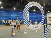 A child is experiencing a ''drone race'' at the first Beijing International Science Festival 2024 in Beijing, China, on August 8, 2024. (