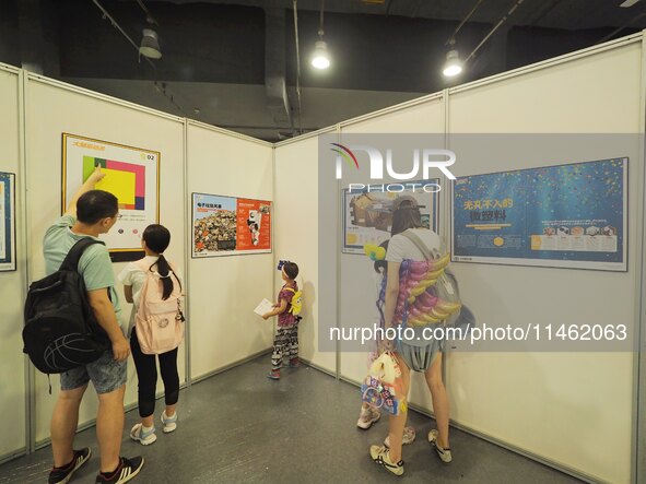 A child is visiting a popular science exhibition at the first Beijing International Science Festival 2024 in Beijing, China, on August 8, 20...