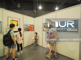 A child is visiting a popular science exhibition at the first Beijing International Science Festival 2024 in Beijing, China, on August 8, 20...