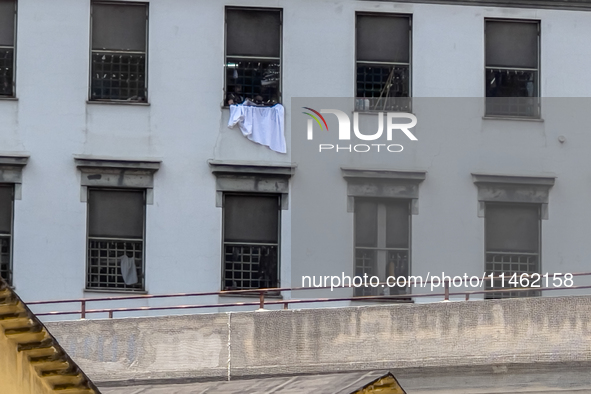 ''Help us, we can't take it anymore.'' These are the cries that are being heard outside the Poggioreale prison in Naples, Italy, on August 8...