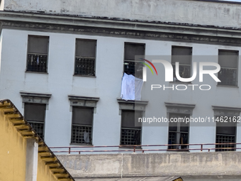 ''Help us, we can't take it anymore.'' These are the cries that are being heard outside the Poggioreale prison in Naples, Italy, on August 8...