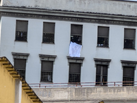 ''Help us, we can't take it anymore.'' These are the cries that are being heard outside the Poggioreale prison in Naples, Italy, on August 8...