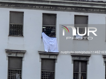 ''Help us, we can't take it anymore.'' These are the cries that are being heard outside the Poggioreale prison in Naples, Italy, on August 8...