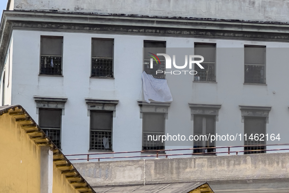 ''Help us, we can't take it anymore.'' These are the cries that are being heard outside the Poggioreale prison in Naples, Italy, on August 8...