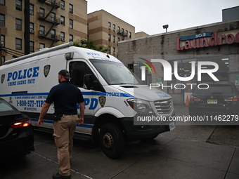 One person is being killed and one person is being injured in a stabbing inside a laundromat in Bronx, New York, United States, on August 8,...