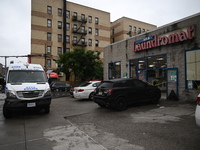 One person is being killed and one person is being injured in a stabbing inside a laundromat in Bronx, New York, United States, on August 8,...