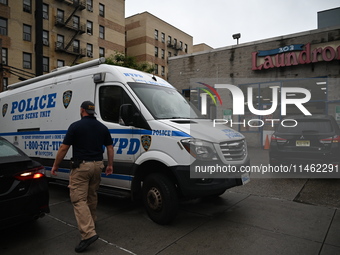 One person is being killed and one person is being injured in a stabbing inside a laundromat in Bronx, New York, United States, on August 8,...