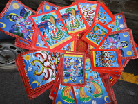 Vendors at a local market near the Patan Durbar Square, a UNESCO World Heritage Site, are selling pictures of the serpent deity ''Naag'' ahe...