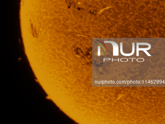 (EDITOR'S NOTE: This image was captured with an H-Alpha solar telescope and is the result of stacking the best 20% of frames. The final stac...