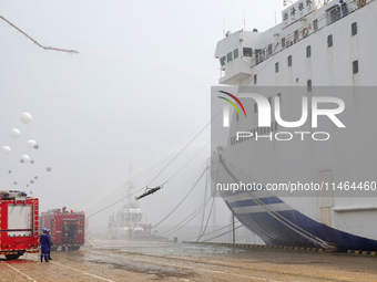 Rescuers are transferring injured people off a ship during a comprehensive defense mobilization exercise in Yantai, China, on August 9, 2024...