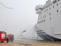 Rescuers are transferring injured people off a ship during a comprehensive defense mobilization exercise in Yantai, China, on August 9, 2024...